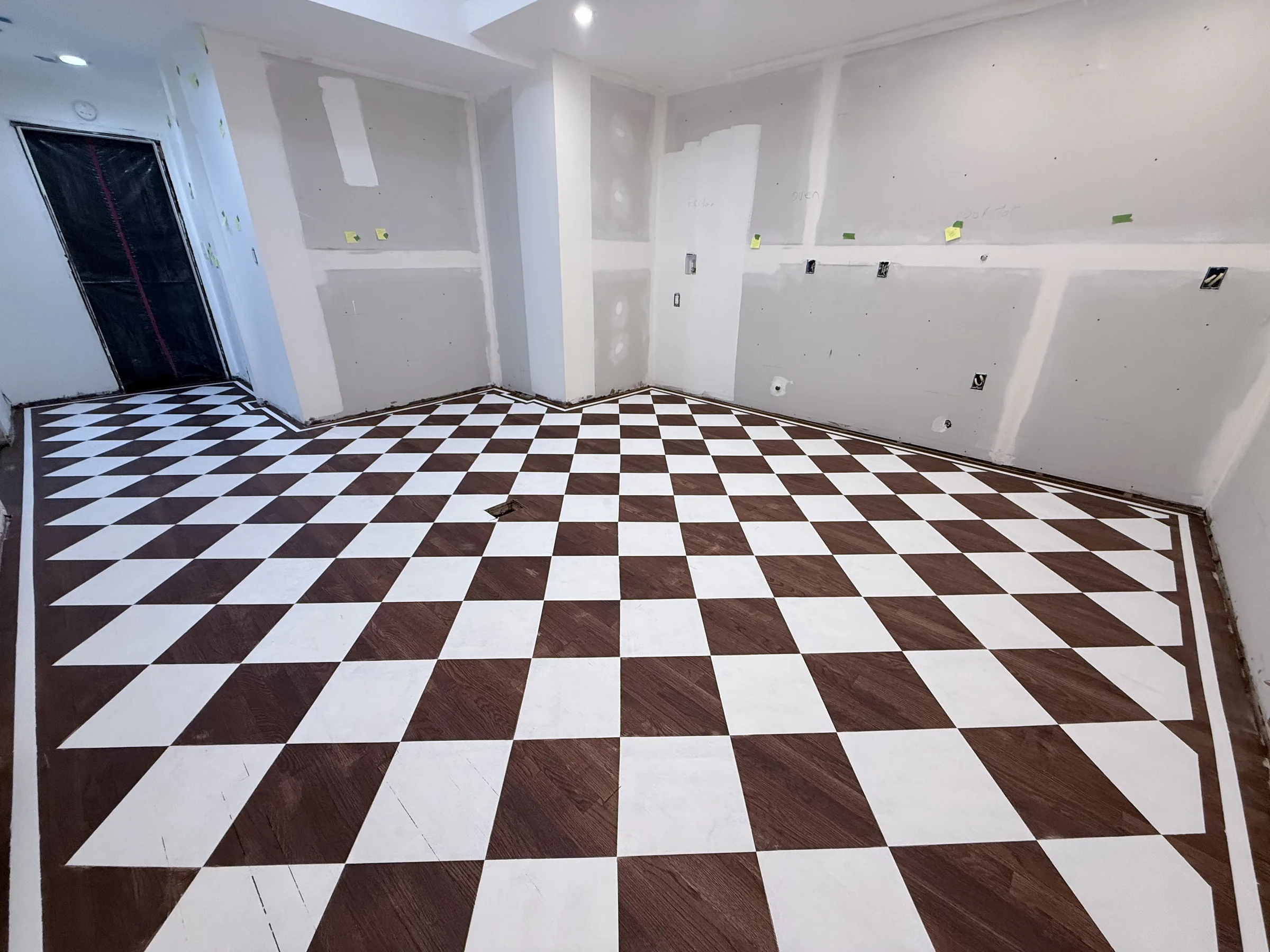 Finished matte chess-pattern floor before the epoxy topcoat was applied