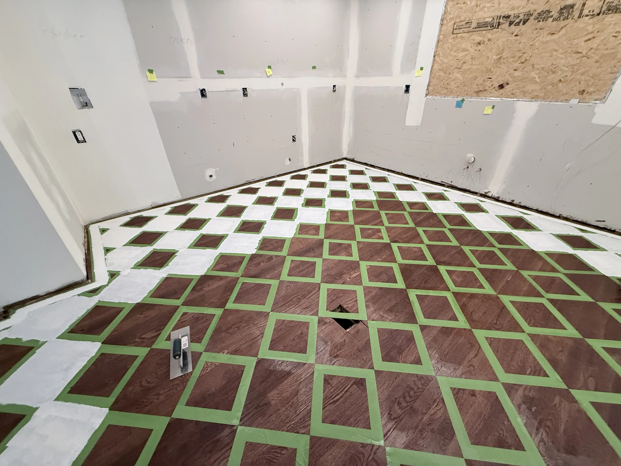 Chess pattern emerging as more diamonds are painted across the floor