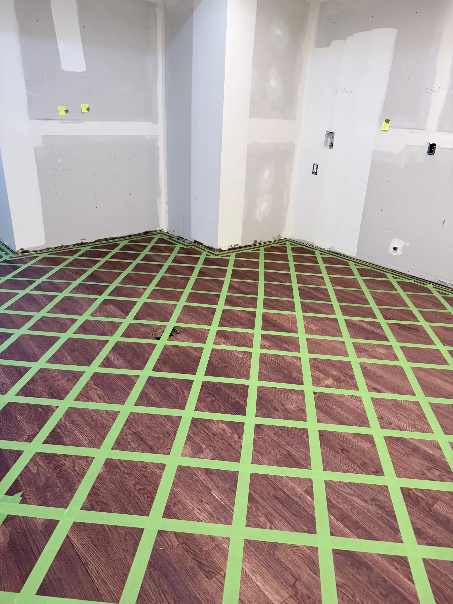 Diagonal diamond grid taped across the full room floor