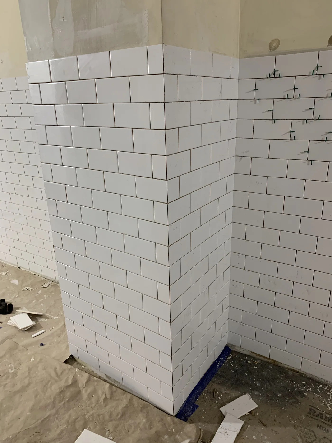 Clean subway tile layout across the customer-facing wall