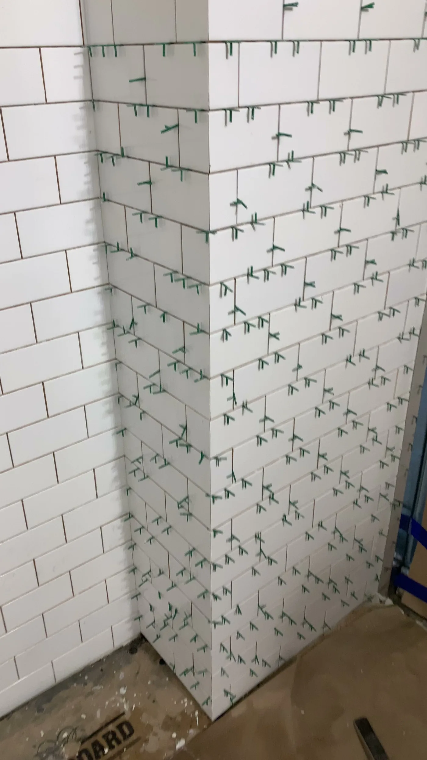 Finished subway tile section before final fixtures and accessories
