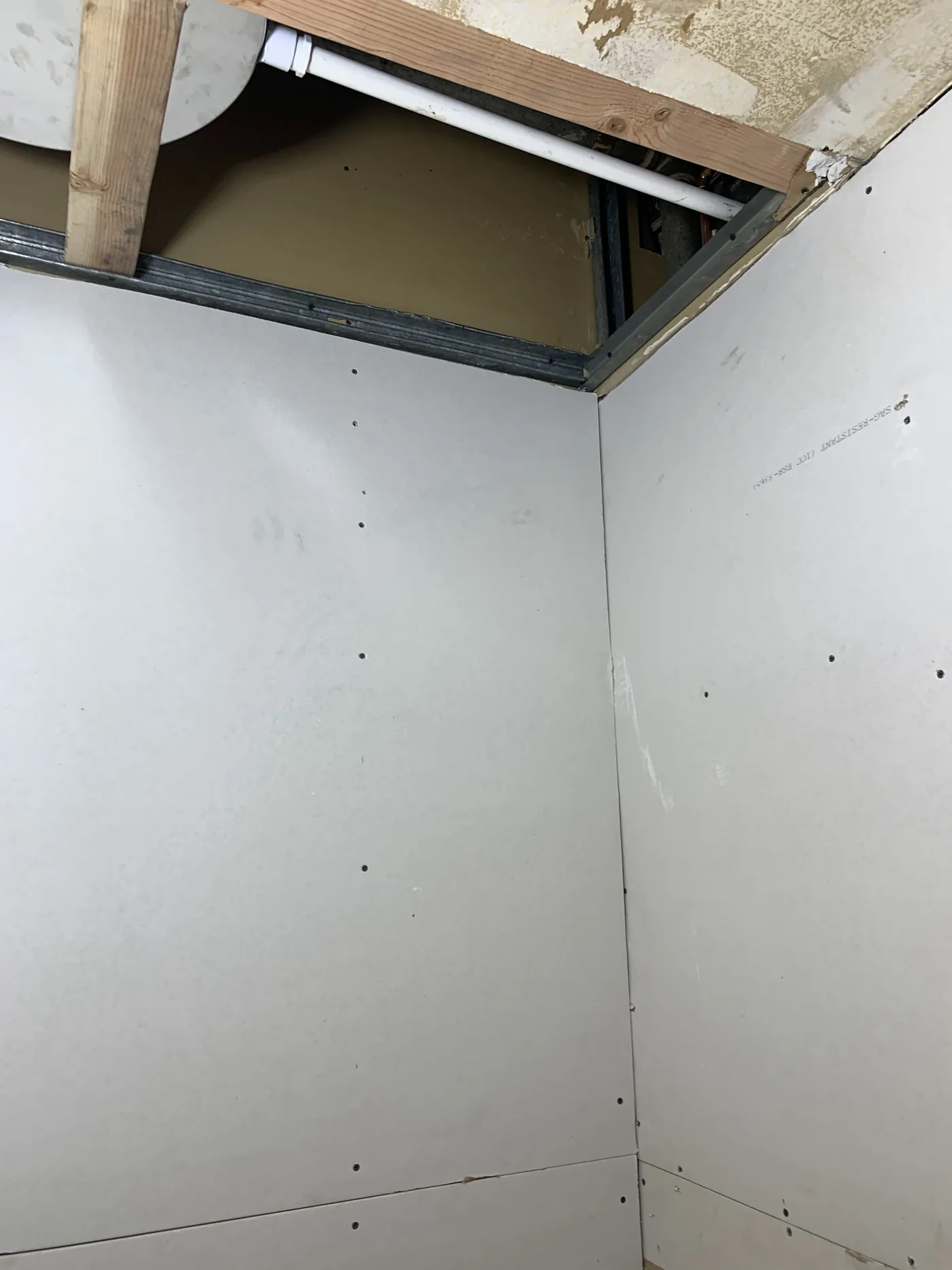 Restroom drywall and ceiling build-out before finish compound and tile