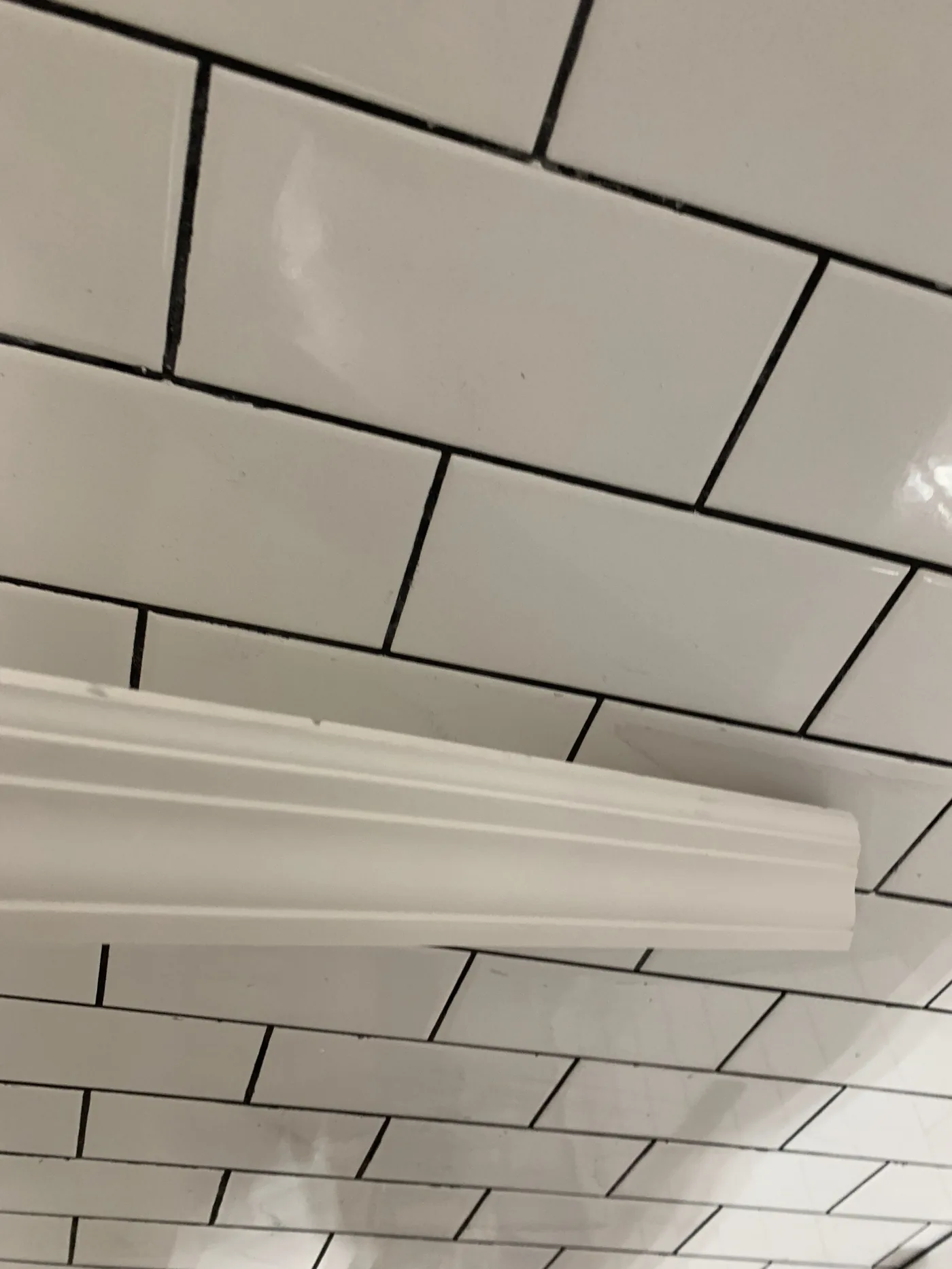 Integrated accent lighting installed between the wood slat panels