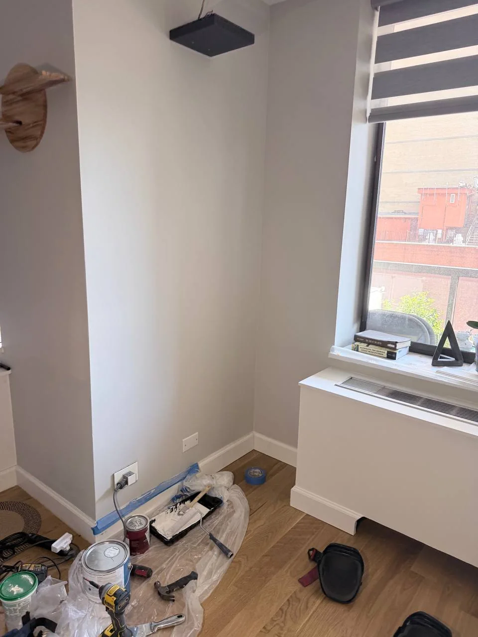 Repaired and repainted corner wall next to the new AC cover box, NYC high-rise apartment