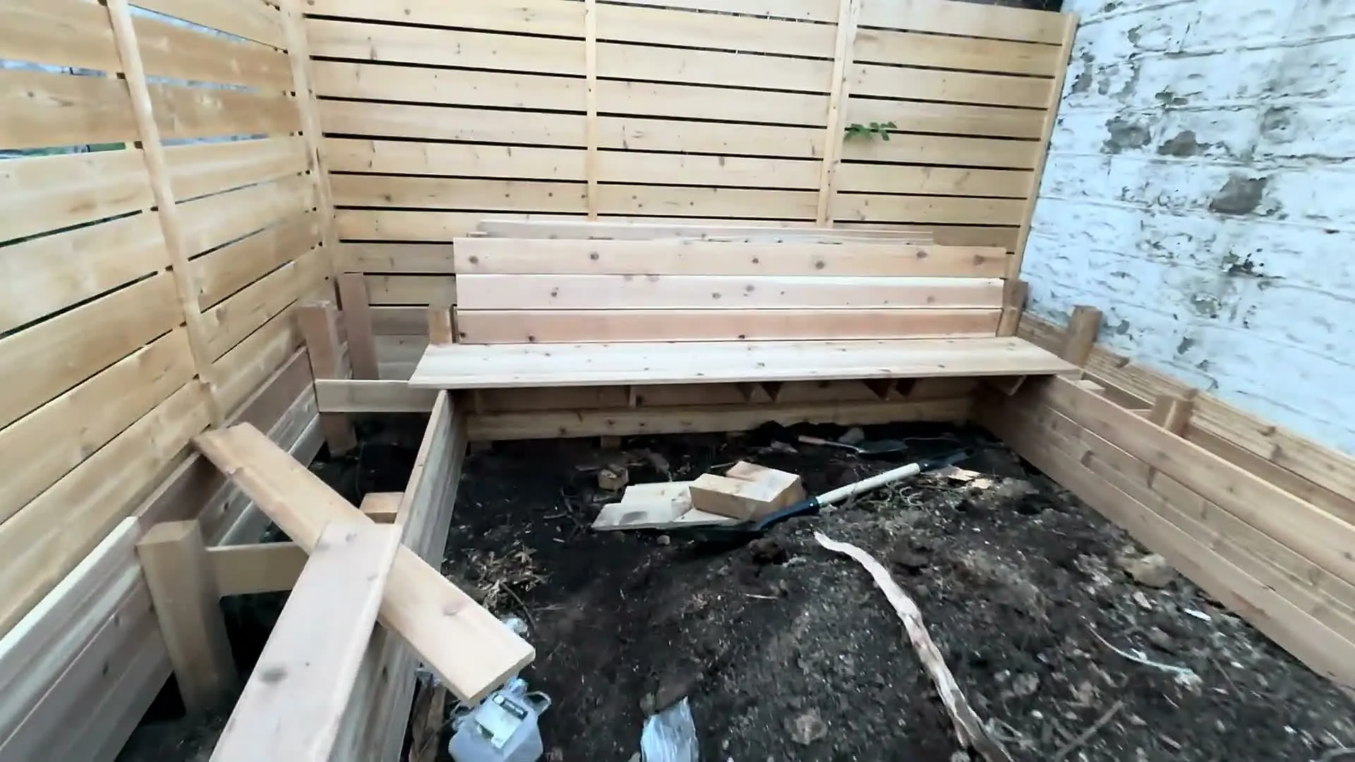 Final wooden bench seat integrated into the planter