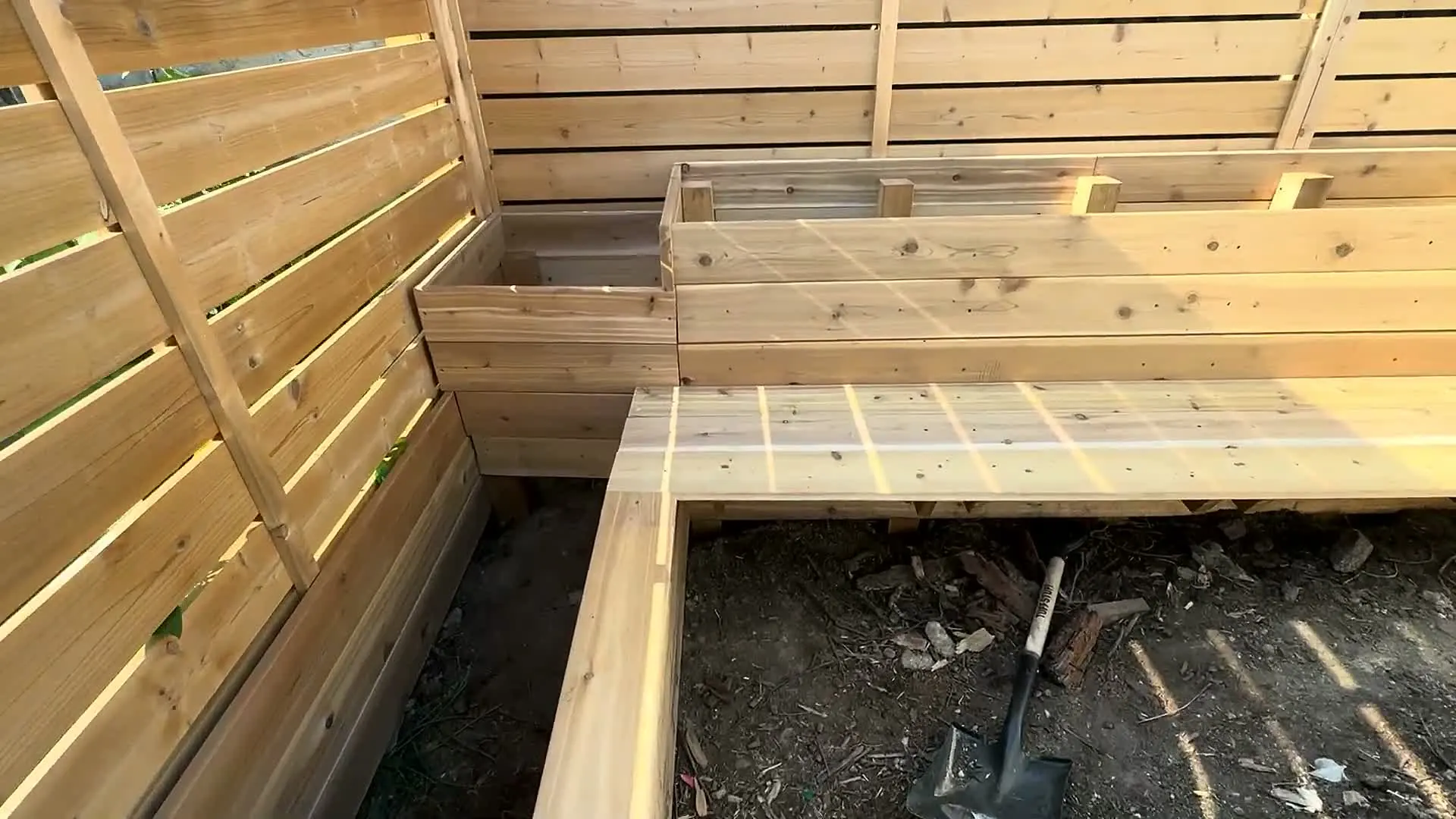 Final detail of wooden planter frame and bench boards