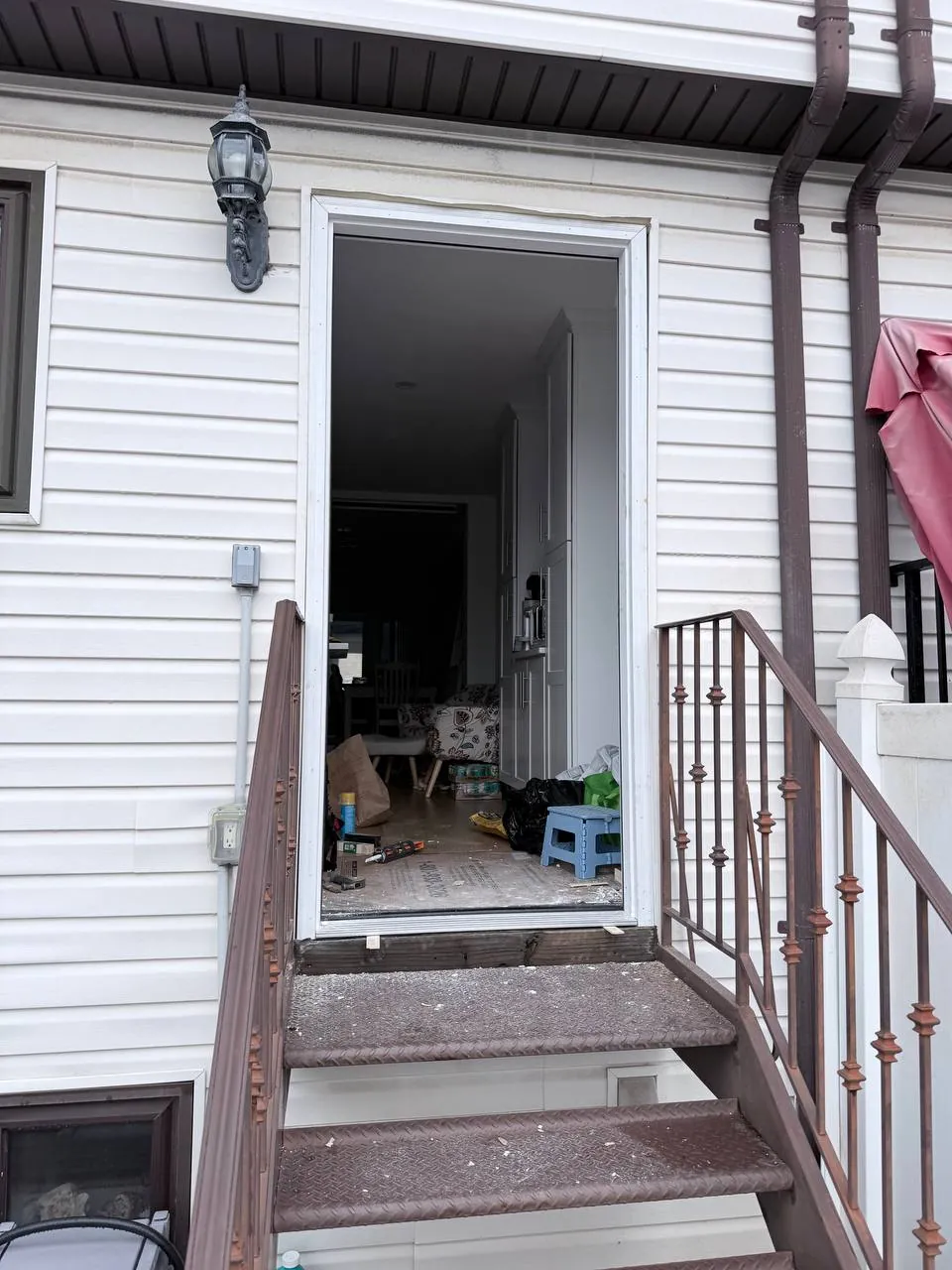New white door frame installed in the opening seen from the deck side