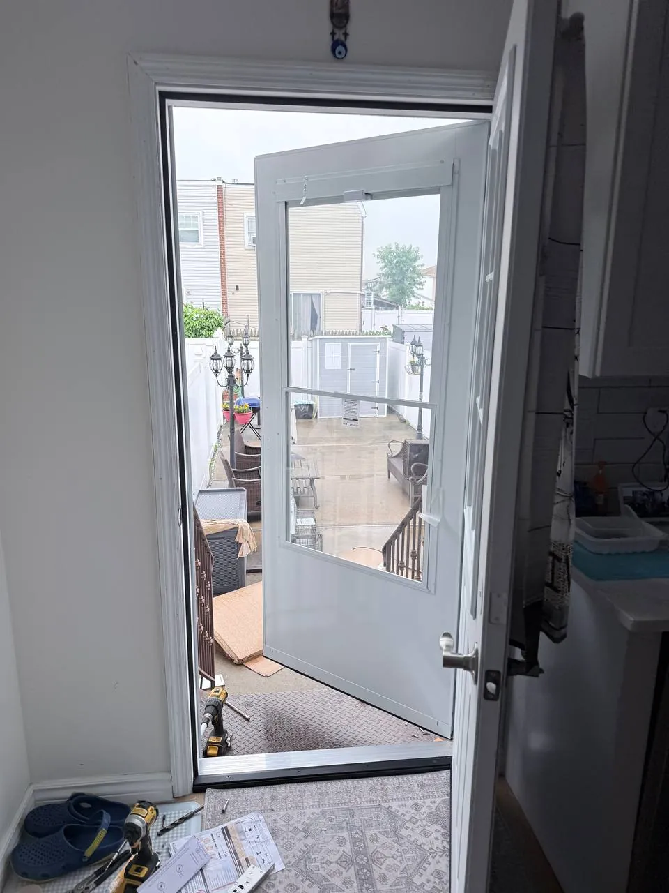Storm door with automatic closer installed, fit checked from inside