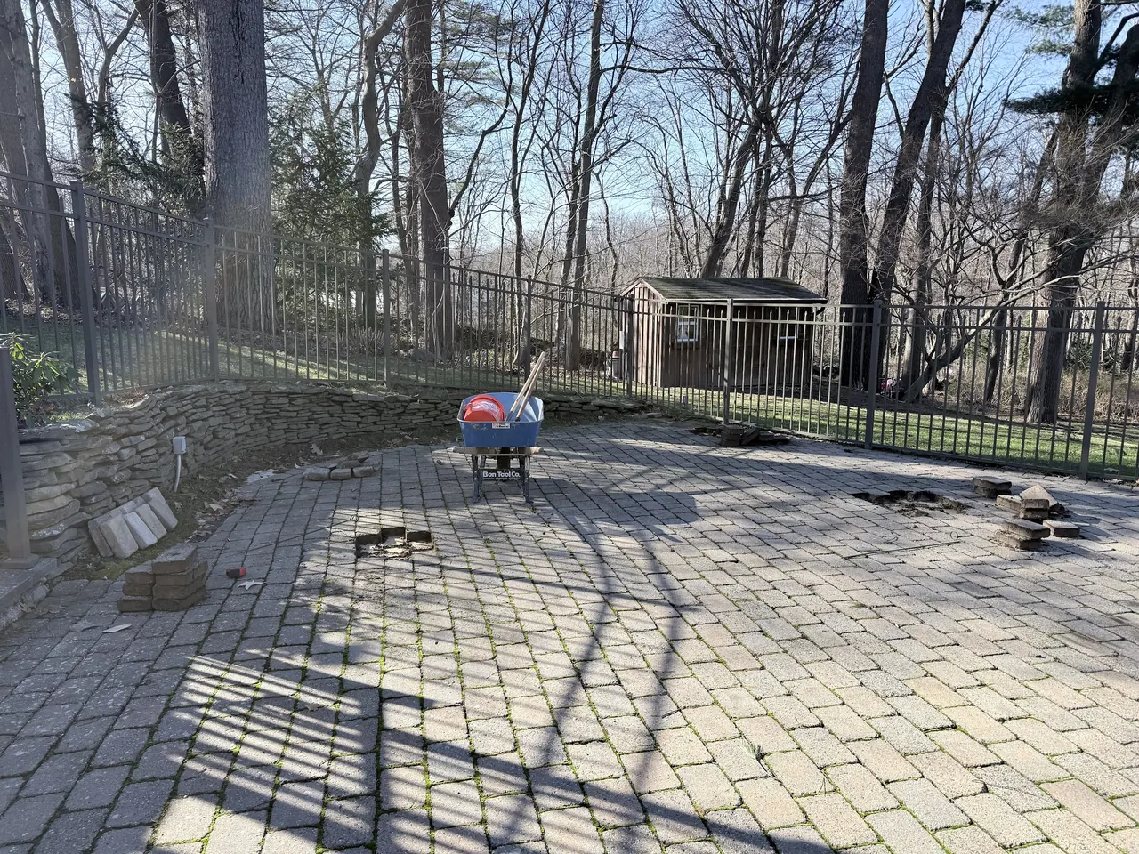 Pavers lifted from the patio to prepare footing locations for the gazebo posts