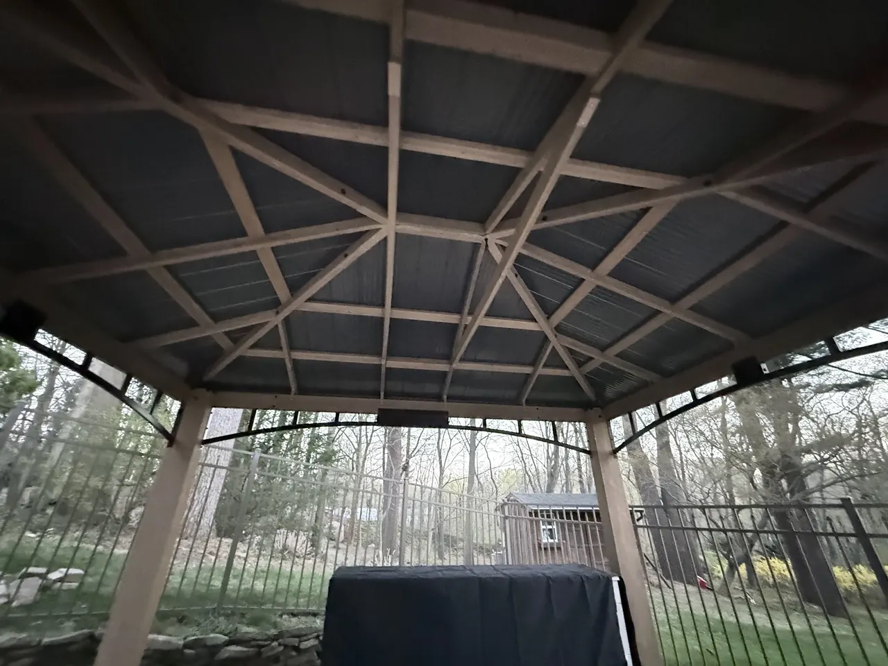 Interior view of the finished gazebo roof framing above the outdoor kitchen island