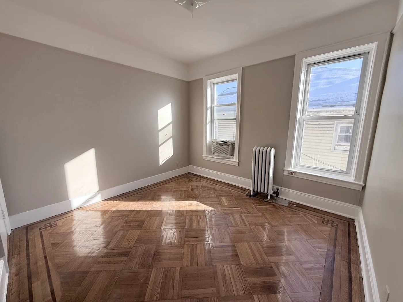 Finished bedroom after repaint and floor refinishing