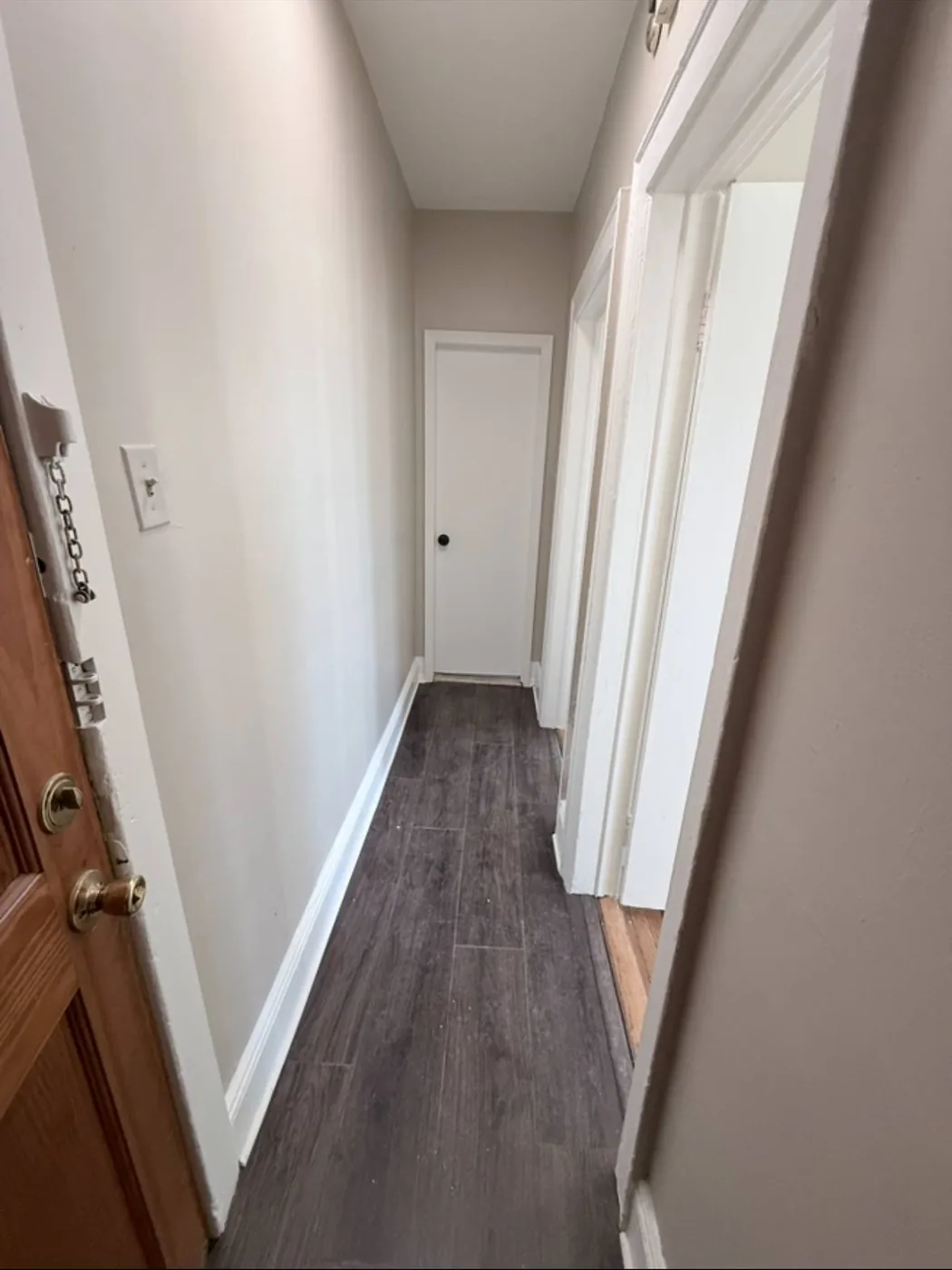 Hallway after apartment turnover with new click-lock vinyl flooring