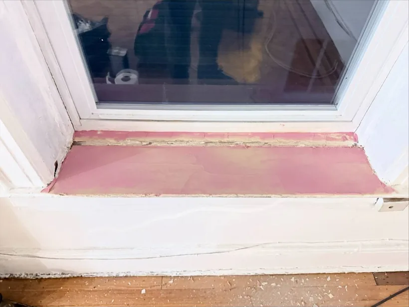Window sill rebuilt with repair filler before paint