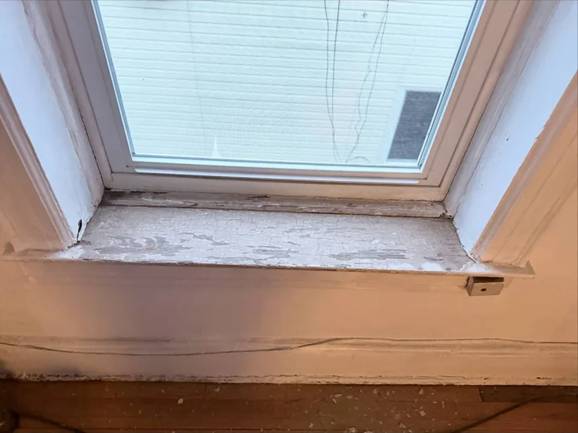 Window sill stripped and sanded during repair