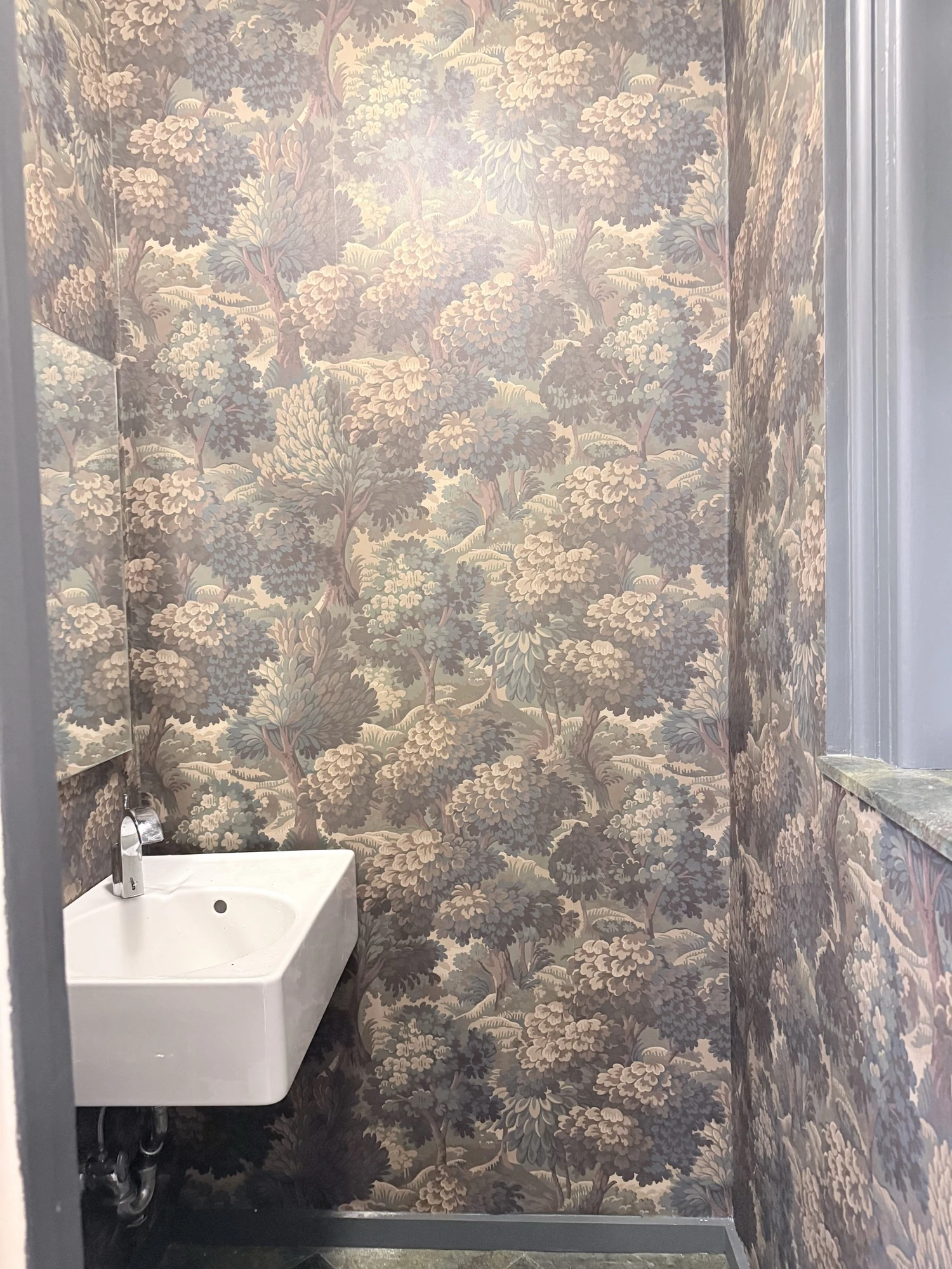A Bold Botanical Wallpaper Powder Room on the Upper West Side